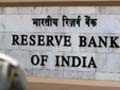 RBI sells dollars as rupee hits record low