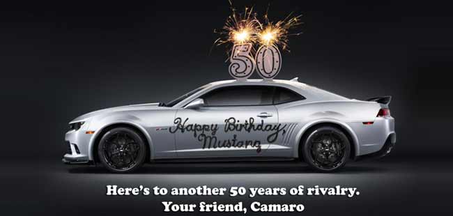 The Chevrolet Camaro says 'Happy 50th' to its rival - the Ford Mustang