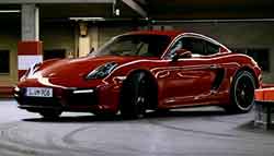 The Porsche Cayman GTS Takes on a Go-Kart Track