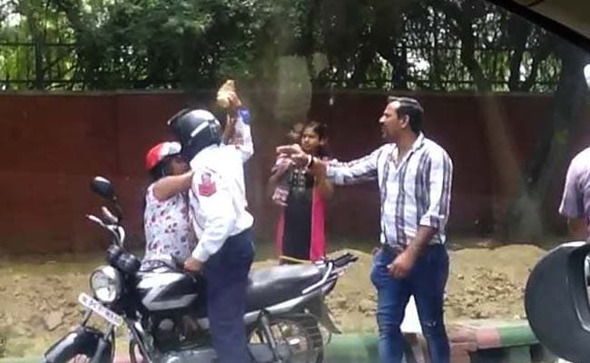 Delhi Cop Caught On Camera Attacking Woman With Brick, Sacked and Arrested