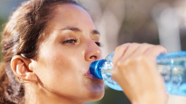 Image result for pregnant woman drinking from plastic bottles