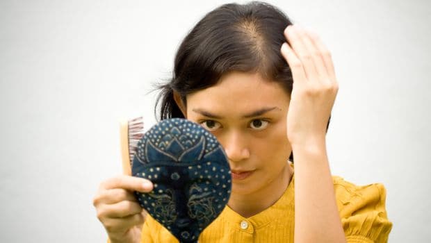 What causes women's hair to fall out?