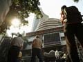 Sensex, Nifty flirt with negative levels in choppy trade