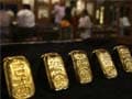 Gold prices edge lower; premiums steady