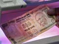 Rupee gains modestly on new RBI steps