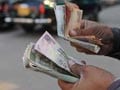 Rupee below 60/dollar, but further rise unlikely: analysts