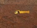 Stung by curbs, iron ore firms throw in the towel