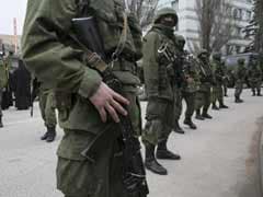Russian markets plunge as Putin tightens Crimea grip
