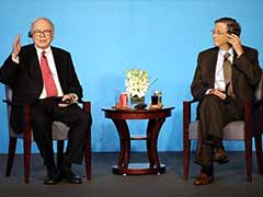 Berkshire opposes dividend proposal; Buffett, Gates get pay rises