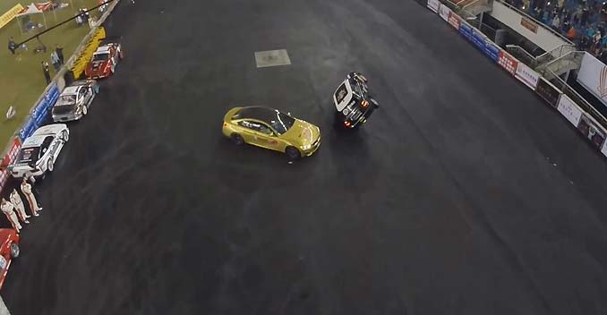 BMW M4 Claims World Record For Running Donuts Around a MINI Cooper Driven on Two Wheels