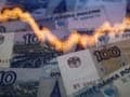 Rouble Jumps on Russia Rate Hike, Oil Pressured