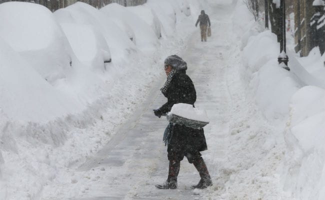 US Northeast Battered by Blizzards After Record Snow