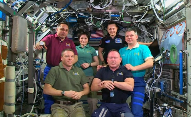 Astronauts Board Space Capsule Soyuz to Return to Earth