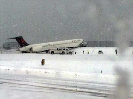 Plane Skids Off Runway in Snowstorm, Shuts New York's LaGuardia Airport Plane Skids Off Runway in Snowstorm, Shuts New York's LaGuardia Airport