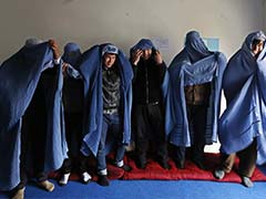 Afghan Men Don Burqas, Take to the Streets for Women's Rights