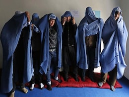 Afghan Men Don Burqas, Take to the Streets for Women's Rights Afghan Men Don Burqas, Take to the Streets for Women's Rights