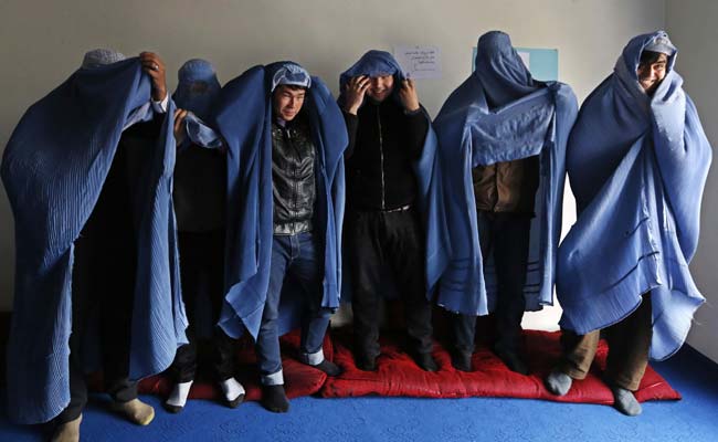 Afghan Men Don Burqas, Take to the Streets for Women's Rights