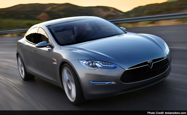 tesla says its model s car will drive itself this summer