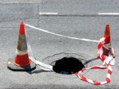 Woman Falls into Hole in London Pavement