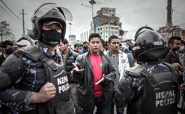 Nepalese Riot Police Battle to Contain Crowds Trying to Leave Kathmandu