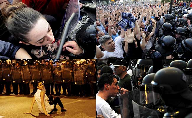 In Powerful Photo of Macedonian Protests, Woman Uses Police Shield to Apply Lipstick