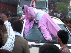 Young Agra Woman's Protest on Top of Mercedes Goes Viral