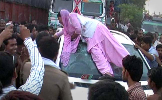 Young Agra Woman's Protest on Top of Mercedes Goes Viral