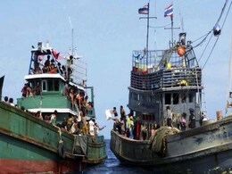 Thai Navy Tows Boat Carrying 400 Migrants Towards Indonesia Thai Navy Tows Boat Carrying 400 Migrants Towards Indonesia