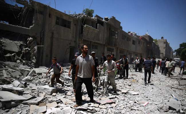 Syria Regime Raids Kill 10 in Damascus Suburb: Report