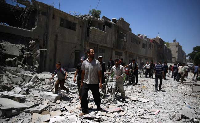 Syria Regime Raids Kill 10 in Damascus Suburb: Report