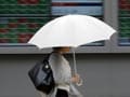 Asia Stocks Up as Wall Street Rally Calms Markets, Dollar Surges