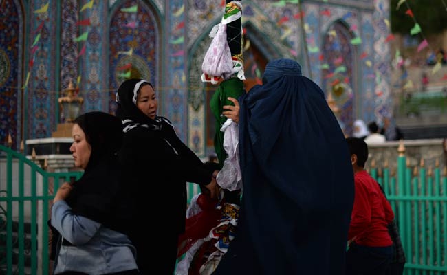 Iran Pilgrims Prevent Nuclear Protest Outside Mosque