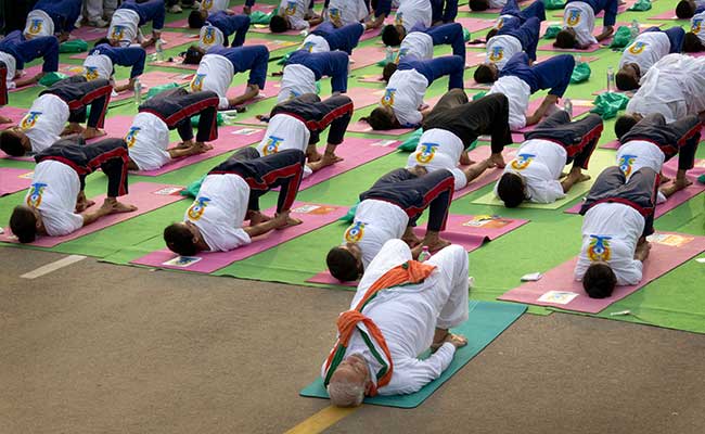 PM Modi Surprises, Takes to Yoga Mat to Lead Thousands in Delhi