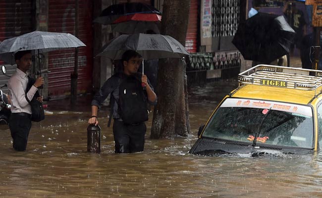 Office-Goers Cycle to Work as Trains Halt Following Rains in Mumbai