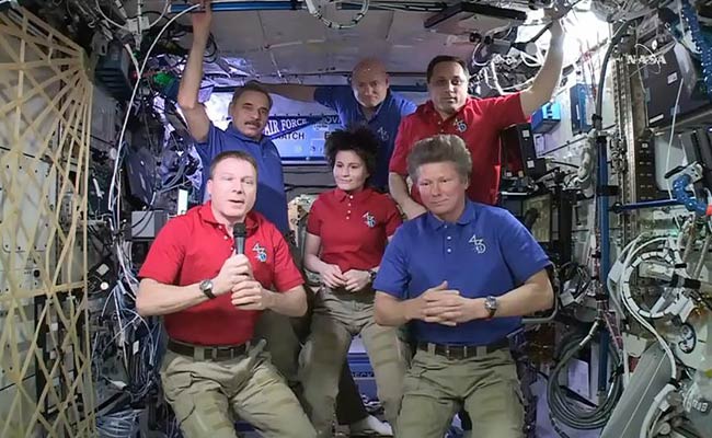 Three astronauts return to Earth after a year in space. NASA's