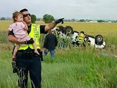 Heartbreaking Picture of Cop Comforting Toddler After a Car Crash Goes Viral