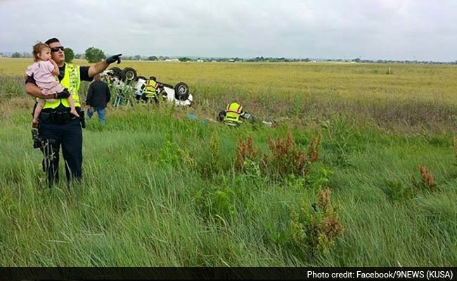 Heartbreaking Picture of Cop Comforting Toddler After a Car Crash Goes Viral