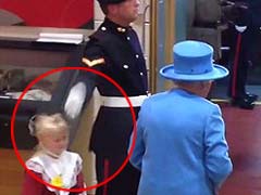 Ouch: Little Girl Hit by Soldier Saluting Britain's Queen