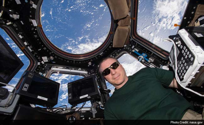 International Space Station Astronaut 'Shakes' Hand with Scientist on Earth