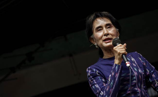 Myanmar's Aung San Suu Kyi Says Party Will Run in Election
