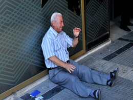 Australian Heads to Greece to Help Crying Pensioner in Photo Australian Heads to Greece to Help Crying Pensioner in Photo