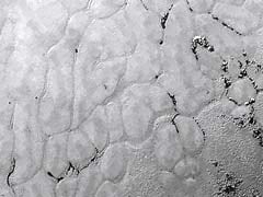 Scientists Puzzle Over Pluto's Polygons