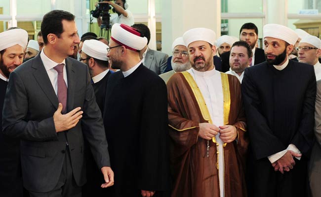 Syria's President Bashar Al-Assad in Rare Public Appearance for Muslim Holiday