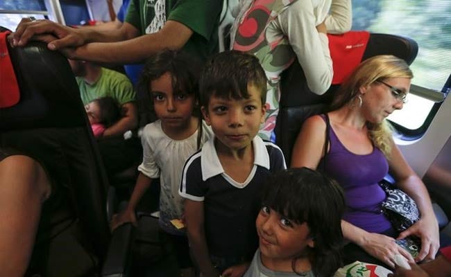 Hungary Lays on Buses for Refugees Walking to Austria