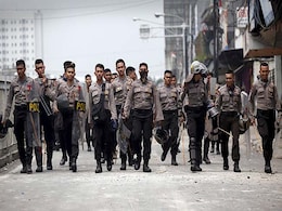Indonesian Police Fire Tear Gas, Water Cannon at Jakarta Protesters Indonesian Police Fire Tear Gas, Water Cannon at Jakarta Protesters