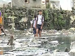 These Mumbai Children Wade Through Knee-Deep Sewage to Make it to School These Mumbai Children Wade Through Knee-Deep Sewage to Make it to School