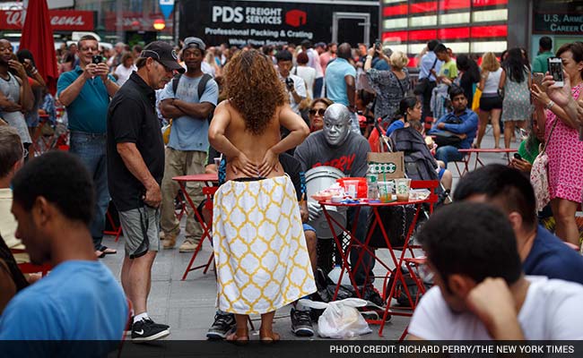 The Topless Take a Pause From Photos in Times Square