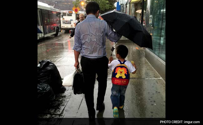 What's Not to Love About This Dad Braving the Rain For His Son?