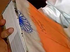 PM Modi Signs Flag to be Gifted to President Obama, Stirs Debate