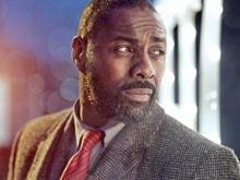 <I>Bond</i> Writer Says Sorry For Calling Idris Elba 'Too Street' to Play 007